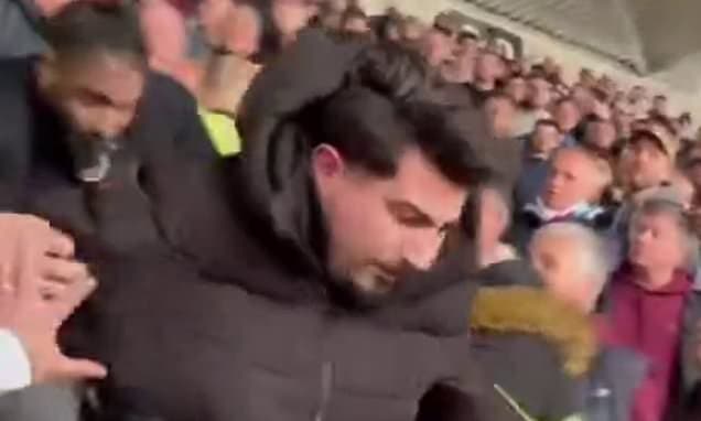 Shocking moment an Arsenal fan is thrown down the stairs at the London Stadium after committing ultimate football sin