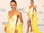 Meghan Markle's 'rival' Emma Thynn turns heads in a daring yellow gown with a thigh-high slit as she makes a glamorous appearance at day one of the Cannes Film Festival