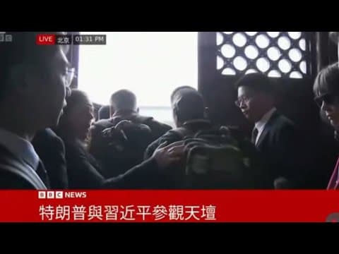 Scuffles erupt in Beijing as White House aide knocked down in clash with media pack