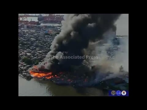 A massive fire burns in a residential area of Manila