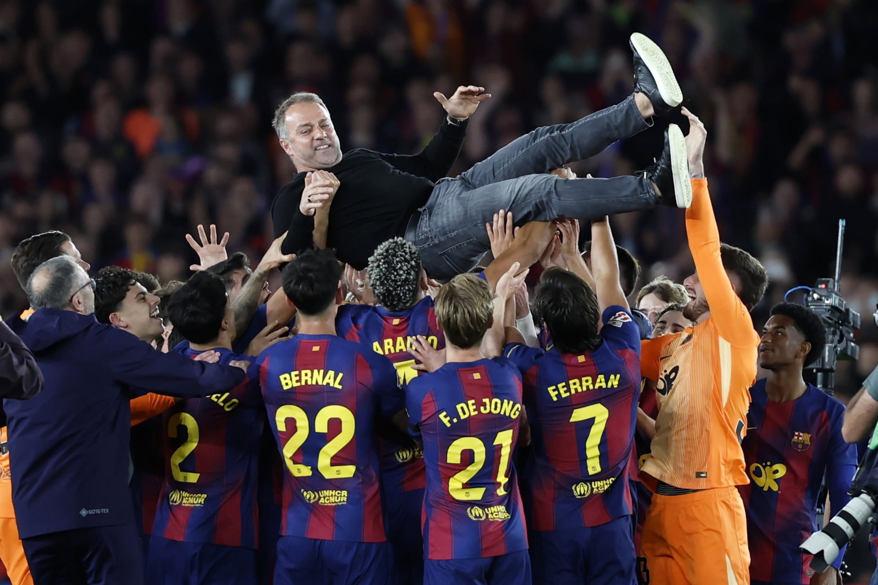 Grieving Flick steers Barcelona past Madrid to retain La Liga crown