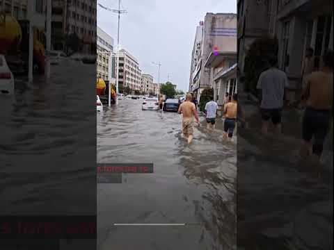 Flooding in southern China washes away cars and destroys bridge