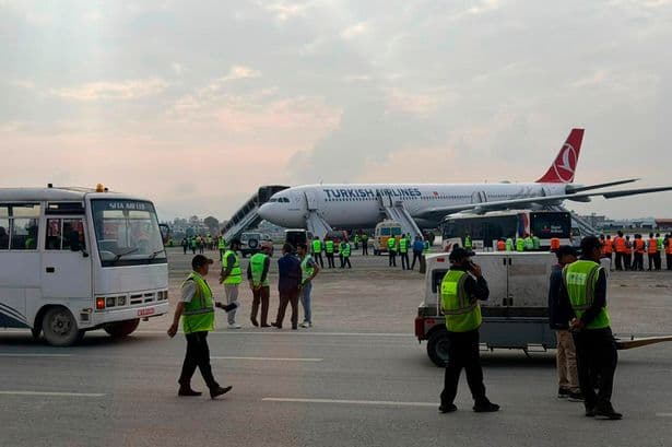 Turkish Airlines passengers use emergency escape on airport runway after fire